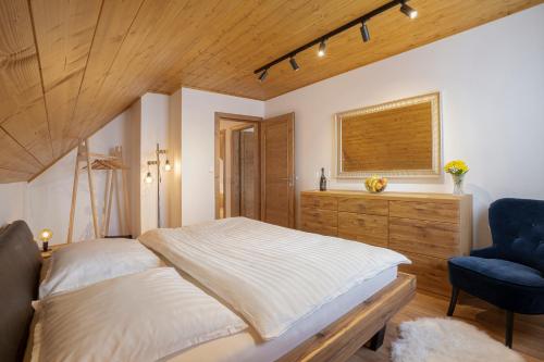 Posteľ alebo postele v izbe v ubytovaní Grand Chalet Stará Lesná