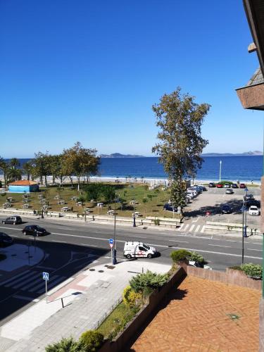 a view of a parking lot with the ocean in the background at Samil 2J in Vigo