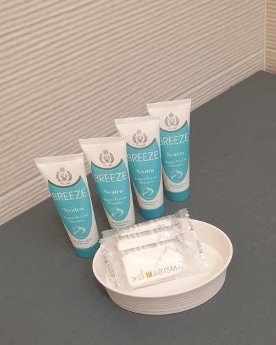 a group of three bottles ofreef products on a table at Margiò House in Sorrento