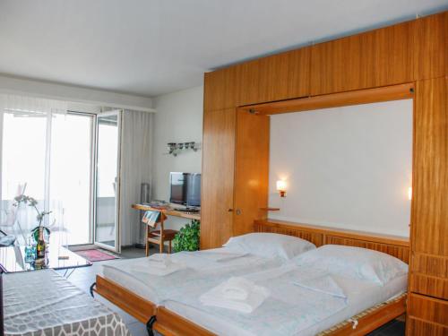 מיטה או מיטות בחדר ב-Apartment Castagnola - Utoring-25 by Interhome
