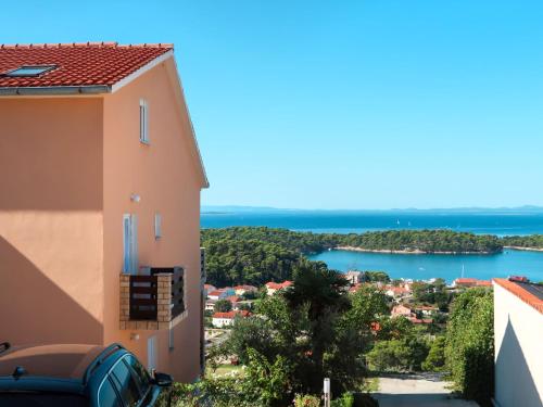 a view of the water from a building at Apartment Andrija - RAB313 by Interhome in Rab