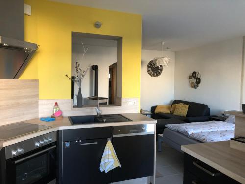 a kitchen with a sink and a stove top oven at Studioapartment, nahe der Meinhardus-Schanze in Meinerzhagen