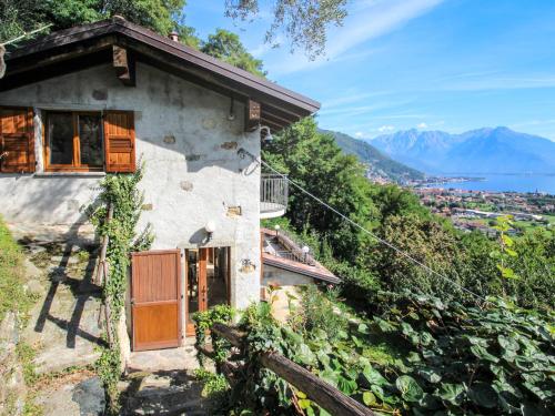 a house on the side of a hill with a view at Holiday Home Ronco by Interhome in Stazzona