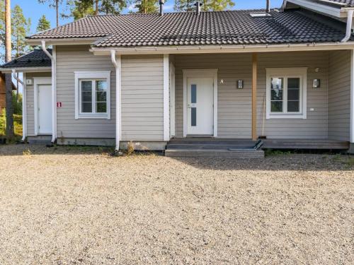 a house with a gravel yard in front of it at Holiday Home 4 seasons hymy a by Interhome in Lahdenperä