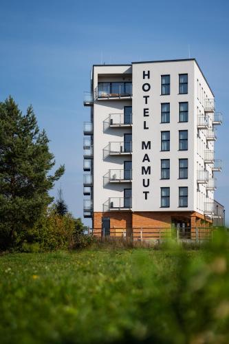 a white building with the word hotel on it at Hotel Mamut in Poprad