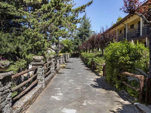 a stone path leading to a house with a fence at Apartment Cancelli trilo 4 persone by Interhome in Marradi