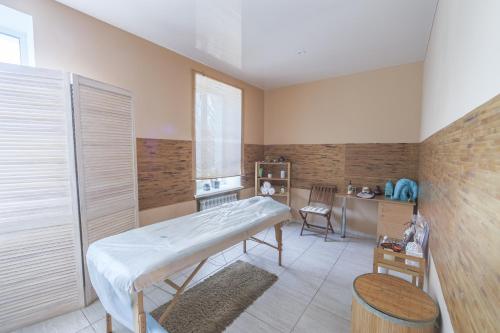 a hospital room with a bed and a desk at Aquadar in Manʼkivka