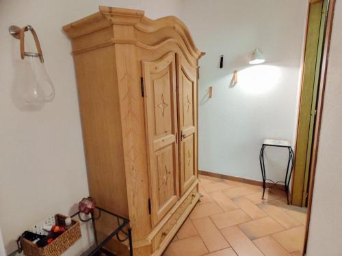 a wooden cabinet in a corner of a room at Holiday Home Villa Massimo by Interhome in Carlazzo