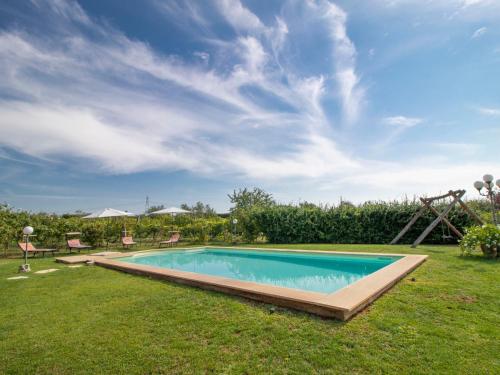 a swimming pool in the yard of a house at Villa La Quercia by Interhome in Vasanello