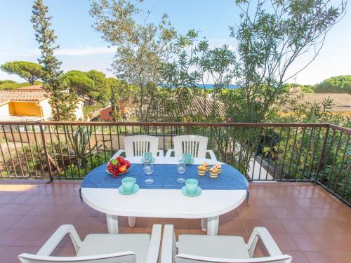 a white table and chairs on a balcony at Apartment Melis 1 by Interhome in Pals