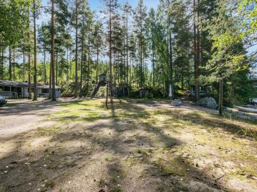 an open yard with a house and trees at Holiday Home Mäntyranta by Interhome in Savonranta