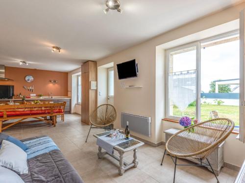a living room with a pool table and a couch at Holiday Home Les palmiers by Interhome in Saint-Philibert