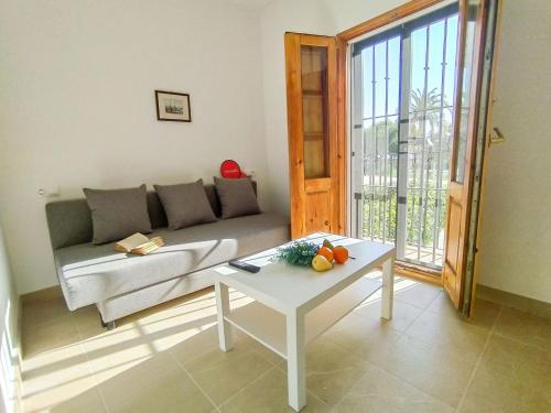 a living room with a couch and a table at Holiday Home Casa Sea Colors by Interhome in Villajoyosa