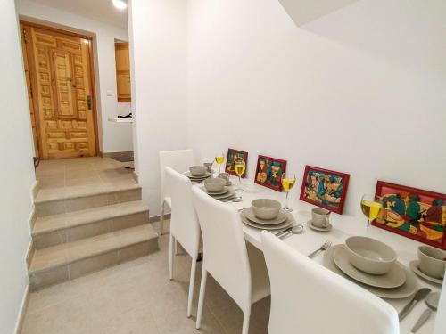 a dining room with a white table and white chairs at Holiday Home Casa Sea Colors by Interhome in Villajoyosa