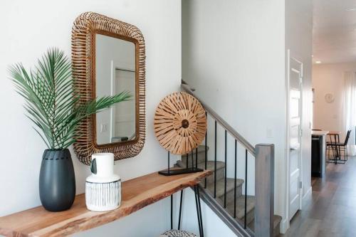 a hallway with a wooden shelf with a mirror at Zen Trail Retreat - New 5 bedroom luxury Condo in St. George