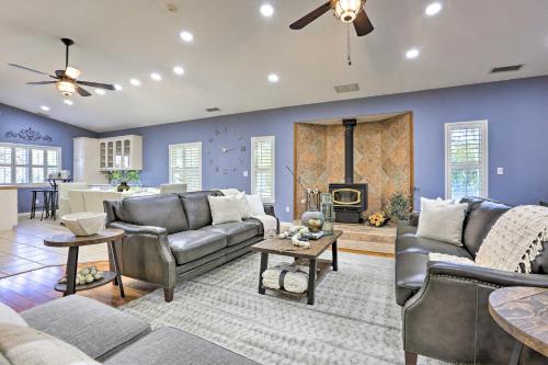 a living room with couches and a fireplace at Chic Ranch-Style Home on 33-Acre Walnut Ranch in Winters