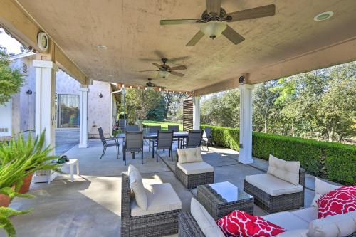 a patio with furniture and a ceiling fan at Chic Ranch-Style Home on 33-Acre Walnut Ranch in Winters