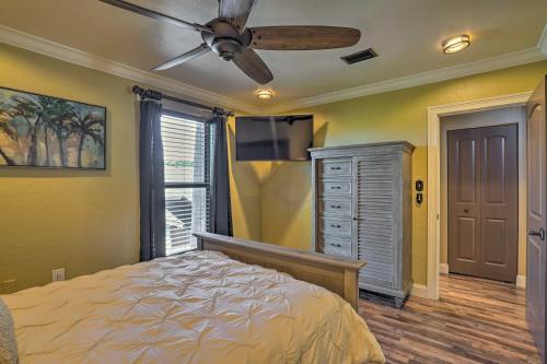 a bedroom with a bed and a ceiling fan at Chic Fort Myers Escape with Community Perks! in Fort Myers
