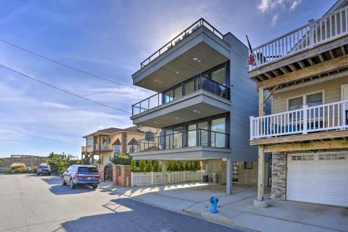 a house with balconies and a car parked in a parking lot at Luxury Long Beach Villa with Ocean Views! in Long Beach
