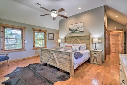 a bedroom with a bed and a ceiling fan at Deck and Hot Tub Mtn-View Gatlinburg Cabin in Gatlinburg
