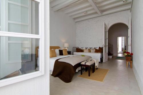 Ένα ή περισσότερα κρεβάτια σε δωμάτιο στο La Casita del Mar