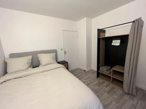 a bedroom with a large white bed and a mirror at New&Cosy - Near Disney/Paris - 100m RER A in Lognes