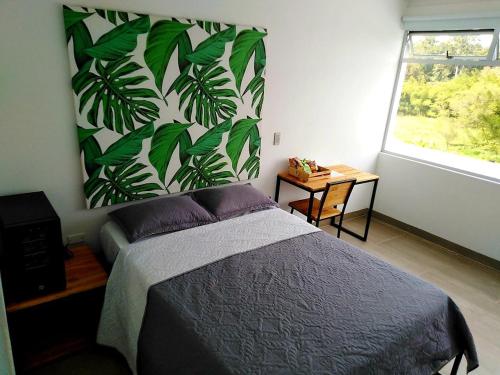 Postel nebo postele na pokoji v ubytování Hotel HACIENDA SAN AGUSTIN