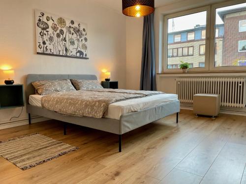 Giường trong phòng chung tại Purple Kitchen - Apartment mit großer Wohnküche