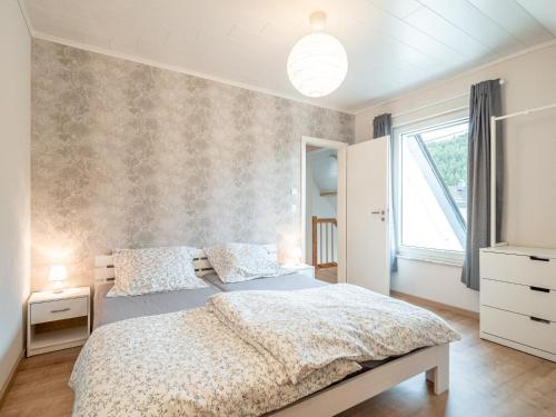 Säng eller sängar i ett rum på Ferienwohnung Zollhaus