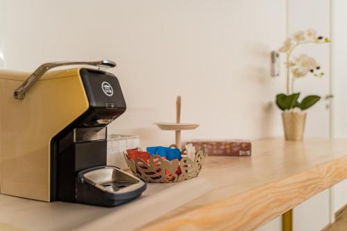 a kitchen counter with a toaster on a counter at Gold Suite B&B in Santeramo in Colle