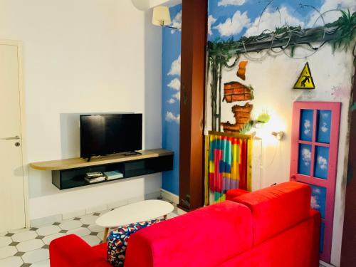 TV a/nebo společenská místnost v ubytování Le Patio Foyalais