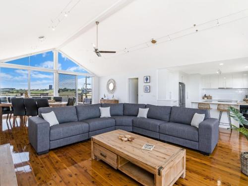a living room with a couch and a table at Salty's - Newly Renovated in Port Fairy