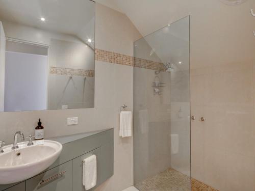 a bathroom with a sink and a shower at Malahide in Port Fairy