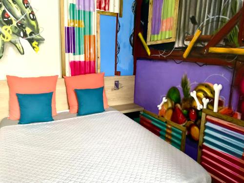 a bedroom with a bed and a pile of fruit at Le Patio Foyalais in Fort-de-France