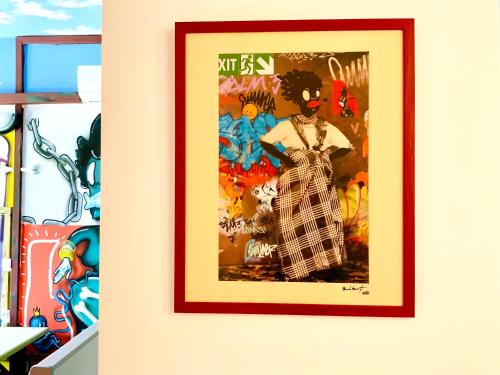 a framed picture of a woman on a wall at Le Patio Foyalais in Fort-de-France