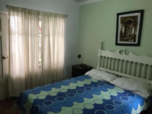 Ένα ή περισσότερα κρεβάτια σε δωμάτιο στο Linda Casa Acogedora