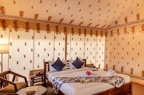 a bedroom with two beds in a room at Rawai Luxury Tents Pushkar in Pushkar