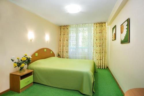 Voodi või voodid majutusasutuse Ivushka Health Resort toas