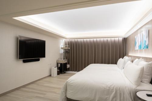 Llit o llits en una habitació de 168 Motel-Zhongli