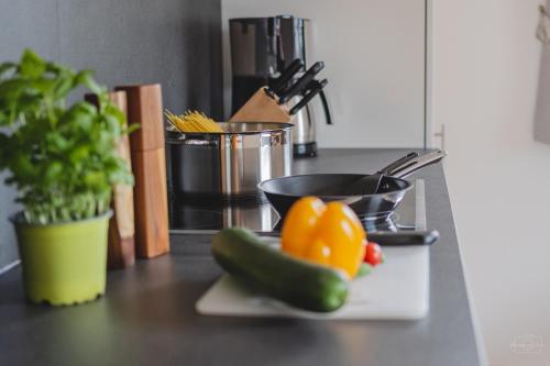 a kitchen counter with a plate with vegetables on it at Apartment Edith in Telfes im Stubai