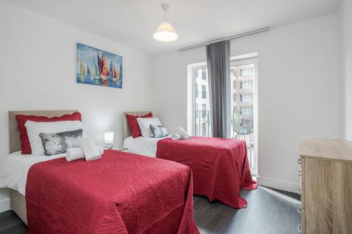 En eller flere senge i et værelse på CONEN Image Two Apartment