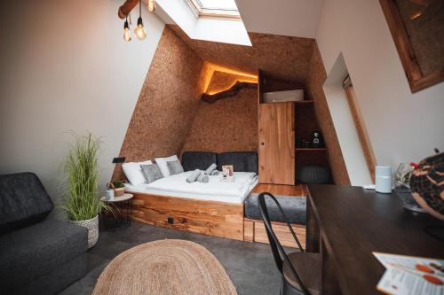 a room with a bed in the middle of a room at Nesting resort Posestvo SONČNI RAJ in Maribor