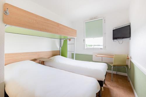 Un ou plusieurs lits dans un hébergement de l'établissement ibis budget Carcassonne Aéroport - A61