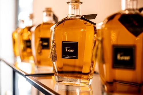 a bottle of liquor sitting on a shelf at Lear Sense Hotel in Gedera