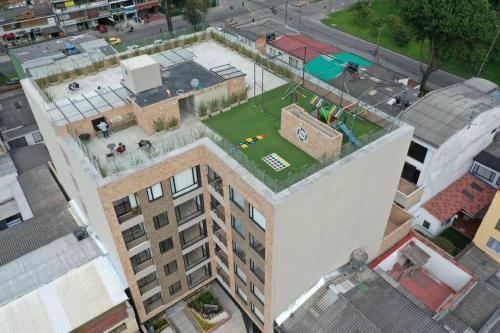 an overhead view of a tall building with a miniature golf at Cómodo y hermoso apartamento para renta. in Bogotá