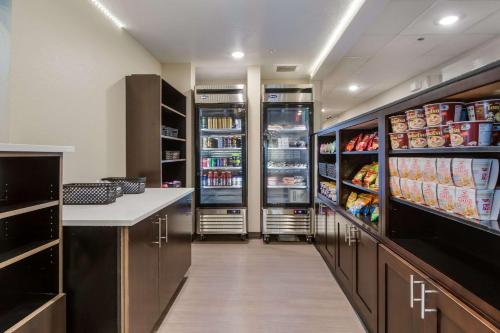 a walk in pantry with an open refrigerator at Sleep Inn Boardman in Boardman