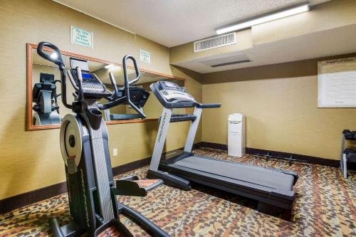 a room with a gym with a treadmill at Sleep Inn & Suites Grand Rapids Southeast - Kentwood in Grand Rapids