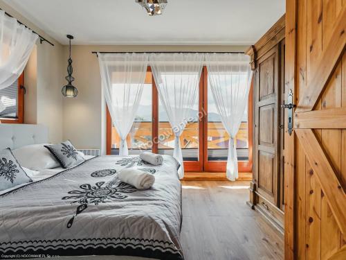 Postel nebo postele na pokoji v ubytování Apartament Skała