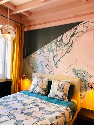 a bedroom with a bed with a map on the wall at Mouraria Deluxe Apartments in Lisbon