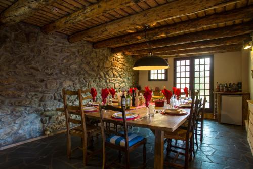 a dining room with a wooden table and chairs at Heyday Chalet in Montriond